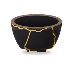 A black raku bowl mended with gold.